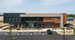 metal siding panels featuring a wood-like appearance, designed and manufactured by iMARK Architectural Metals. The panels combine the durability of metal with the natural aesthetic of wood, offering a stylish and long-lasting exterior solution for buildings.